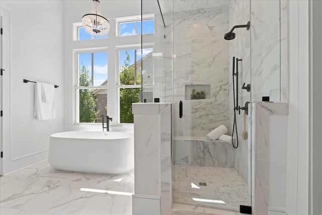 bathroom featuring a notable chandelier and plus walk in shower