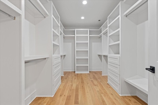 walk in closet featuring light hardwood / wood-style floors