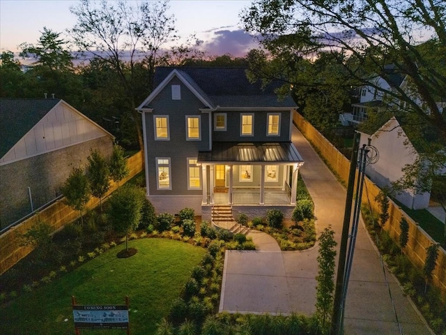 view of front facade featuring a yard and a porch