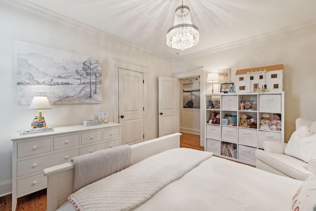 bedroom with an inviting chandelier, crown molding, and dark wood-type flooring