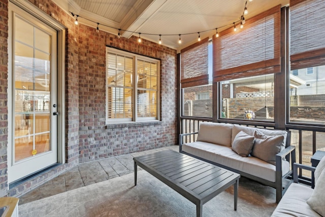 sunroom featuring wooden ceiling and beam ceiling