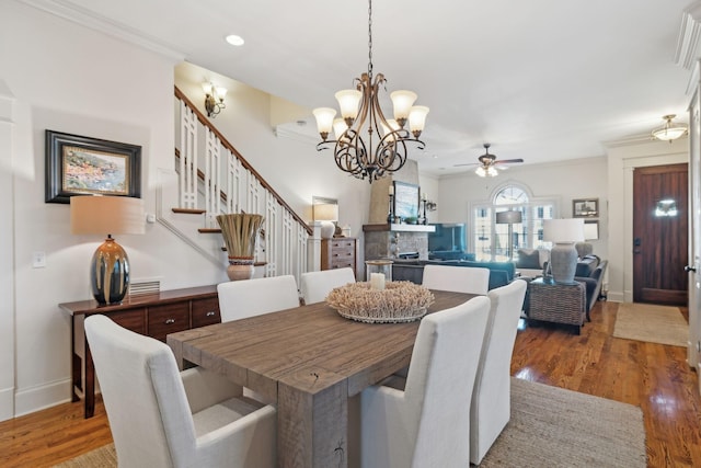 dining room with ceiling fan, hardwood / wood-style floors, and ornamental molding