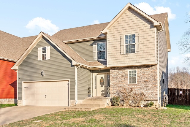 front of property with a front lawn and a garage