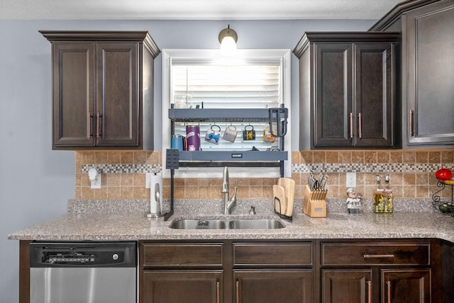 kitchen with sink, dishwasher, decorative backsplash, and dark brown cabinetry