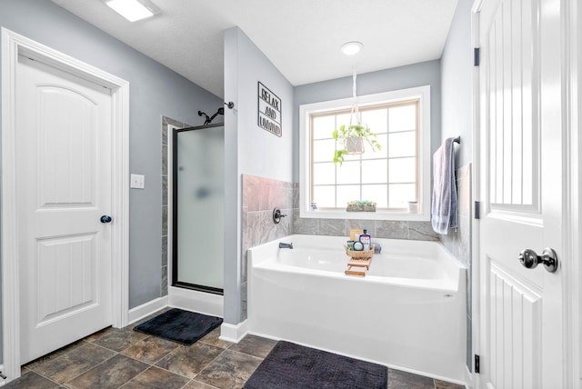 bathroom featuring plus walk in shower