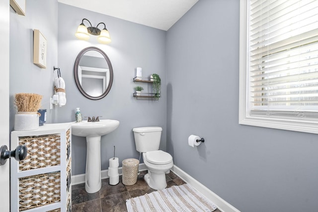 bathroom featuring sink and toilet