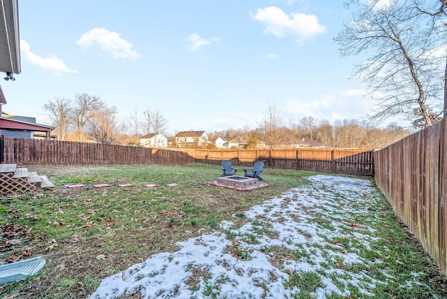 view of yard featuring a fire pit