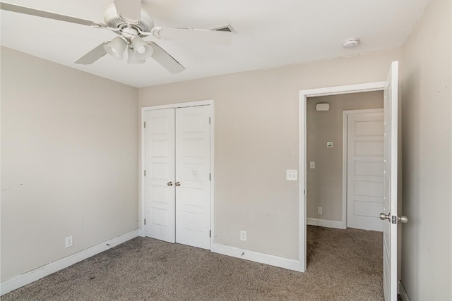 unfurnished bedroom with a closet, ceiling fan, and carpet flooring