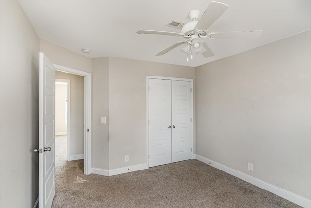 unfurnished bedroom featuring a closet, ceiling fan, and carpet floors