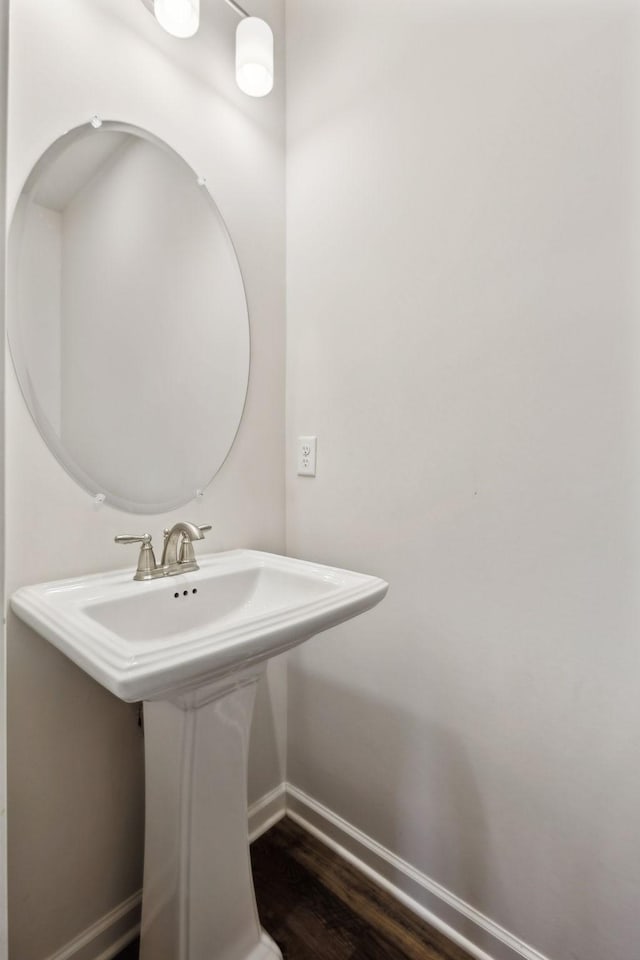 bathroom featuring sink and hardwood / wood-style floors