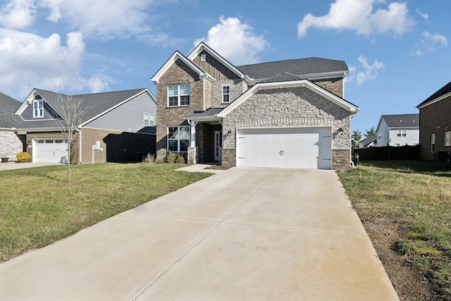 view of front of house featuring a front yard and a garage