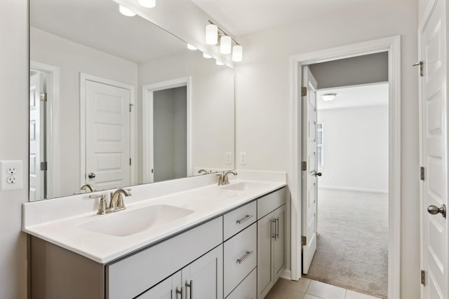 bathroom with tile patterned floors and vanity