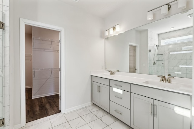 bathroom featuring vanity and walk in shower