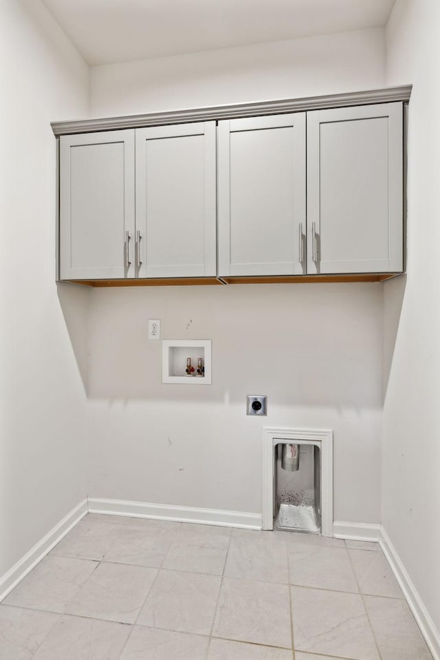 clothes washing area featuring light tile patterned flooring, hookup for a washing machine, cabinets, and hookup for an electric dryer