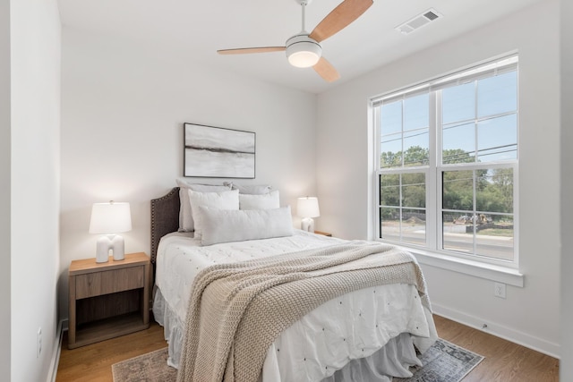 bedroom featuring ceiling fan and wood-type flooring