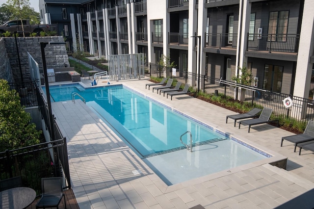 view of pool featuring a patio area