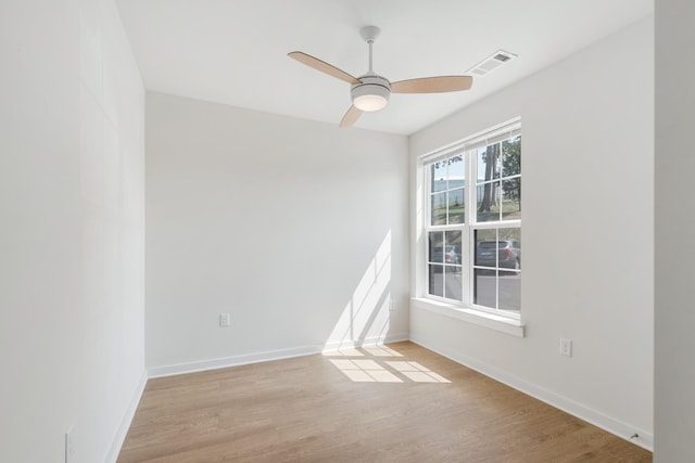 spare room with ceiling fan and light hardwood / wood-style floors