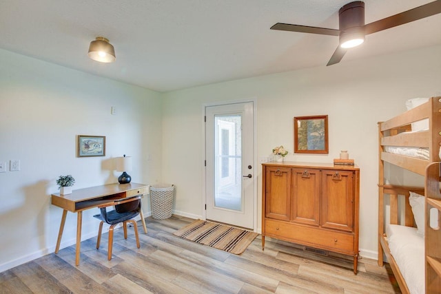 entryway with ceiling fan and light hardwood / wood-style flooring