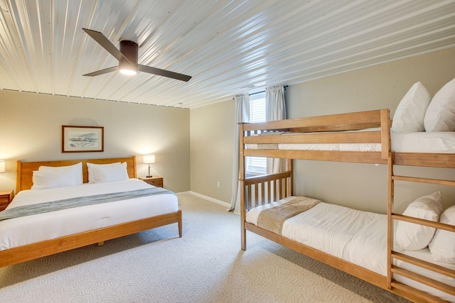 bedroom featuring ceiling fan and carpet