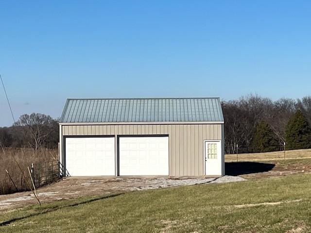 garage featuring a yard