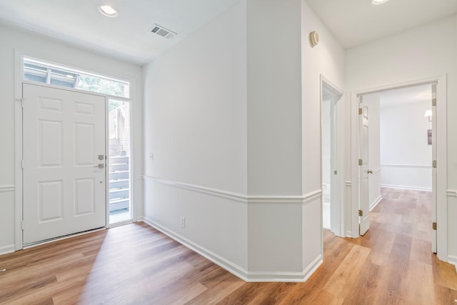 foyer entrance with light wood-type flooring