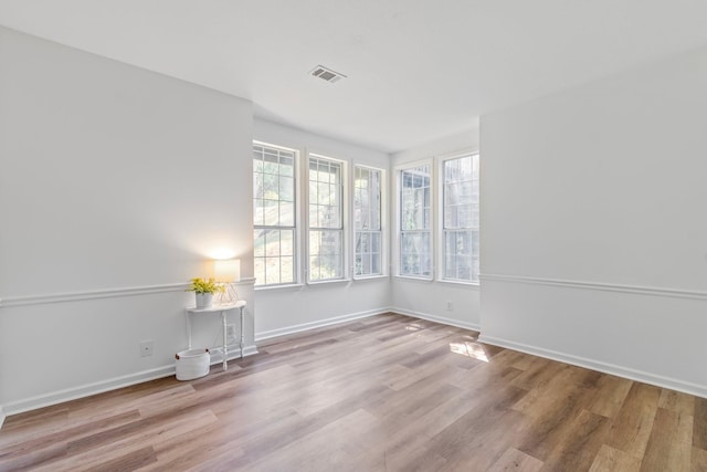 unfurnished room with light hardwood / wood-style flooring