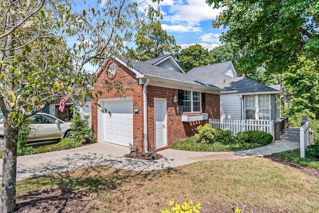 view of front facade featuring a garage and a front lawn