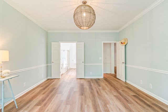 unfurnished bedroom with ornamental molding and light hardwood / wood-style flooring