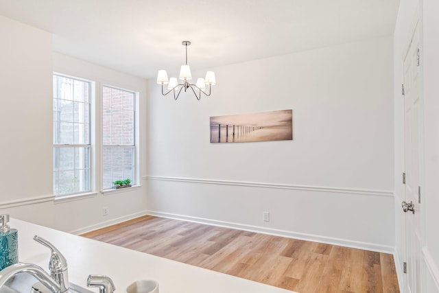 dining space featuring a chandelier and hardwood / wood-style flooring