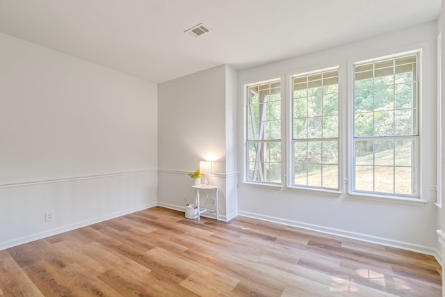 spare room with light hardwood / wood-style floors