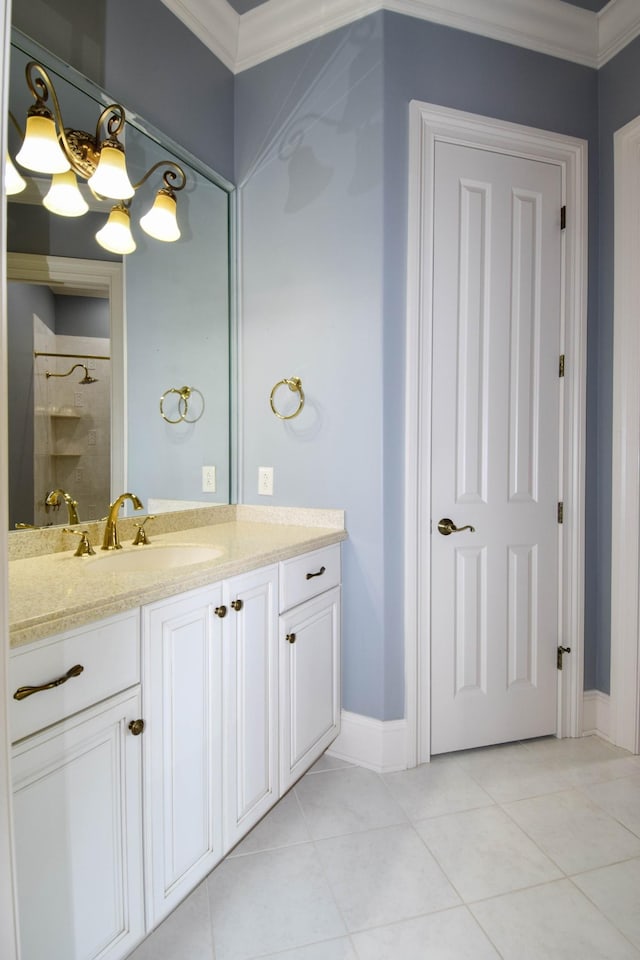 bathroom featuring ornamental molding, walk in shower, vanity, and tile patterned floors