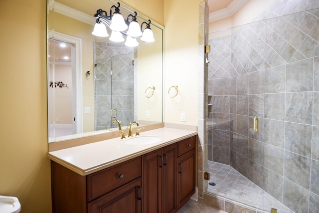 bathroom featuring ornamental molding, vanity, and a shower with shower door