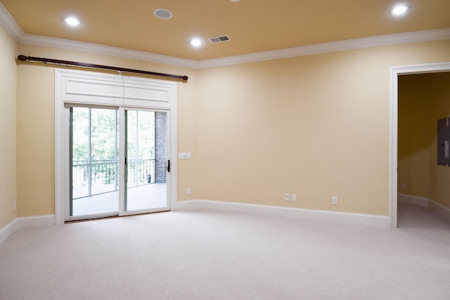 carpeted spare room featuring electric panel and ornamental molding