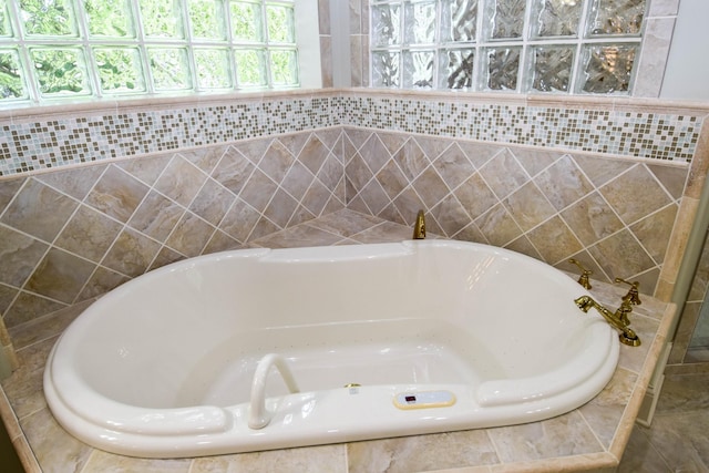 bathroom with tiled bath