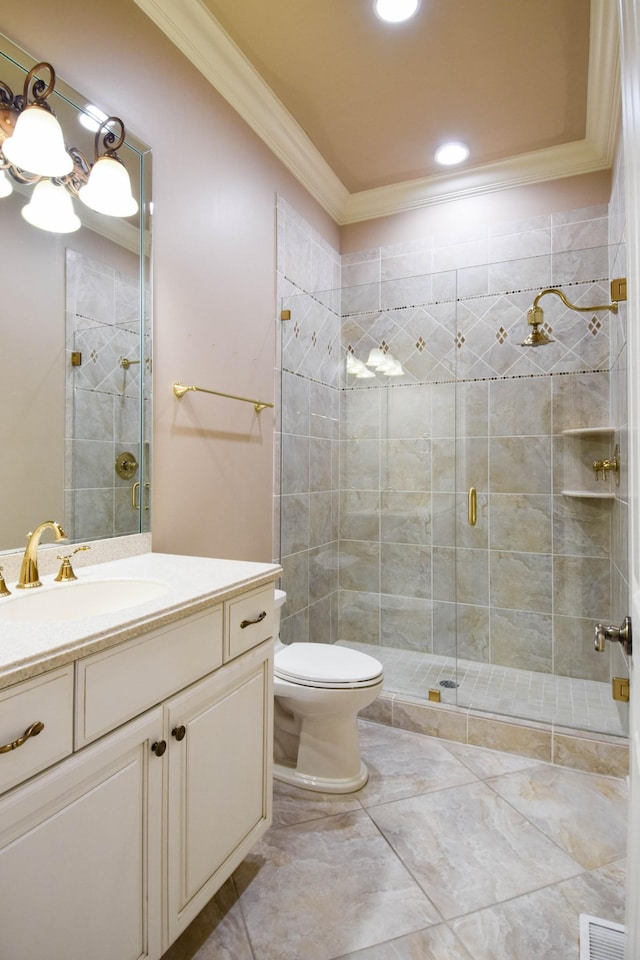 bathroom featuring toilet, vanity, a shower with shower door, and ornamental molding