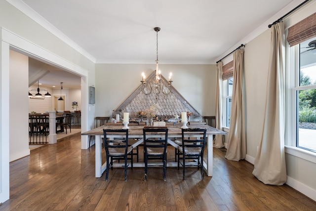 dining space with a chandelier, crown molding, and dark wood-type flooring