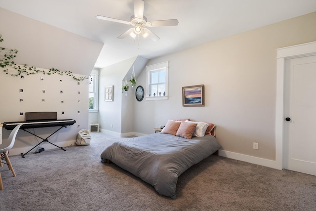 bedroom featuring ceiling fan, vaulted ceiling, and carpet flooring