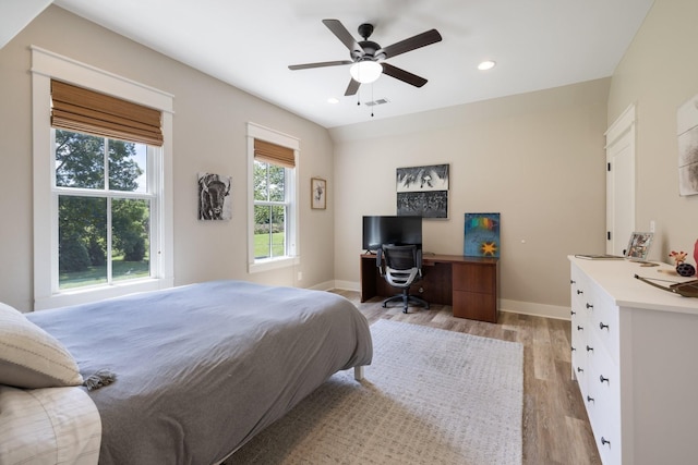 bedroom featuring ceiling fan and light hardwood / wood-style flooring