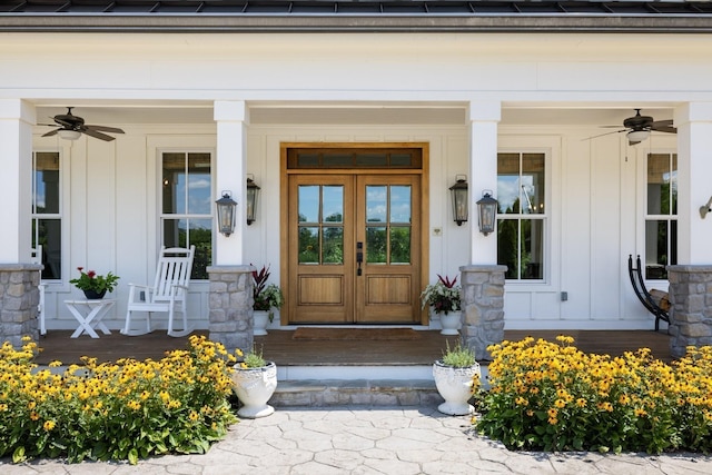 view of exterior entry with ceiling fan and a porch