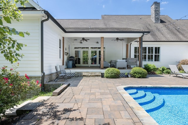 rear view of house with ceiling fan, french doors, a patio, and outdoor lounge area