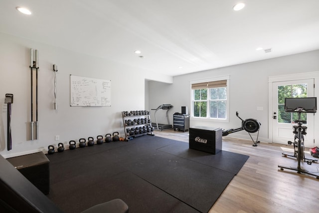 exercise area featuring hardwood / wood-style floors