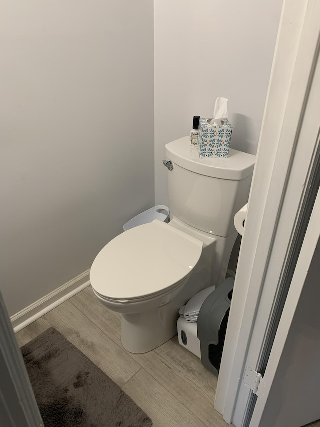 bathroom featuring toilet and hardwood / wood-style flooring