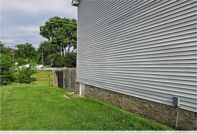 view of property exterior with a yard