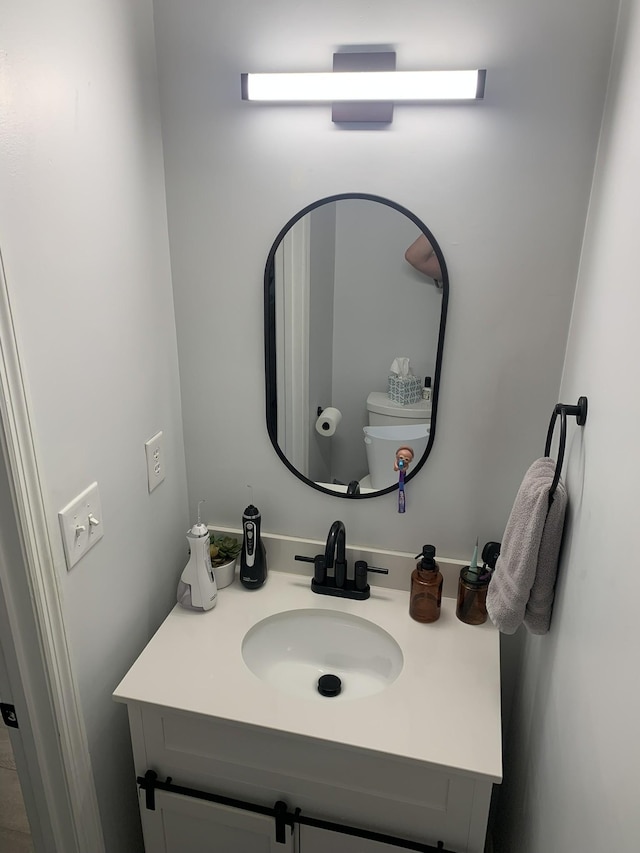 bathroom with vanity and toilet