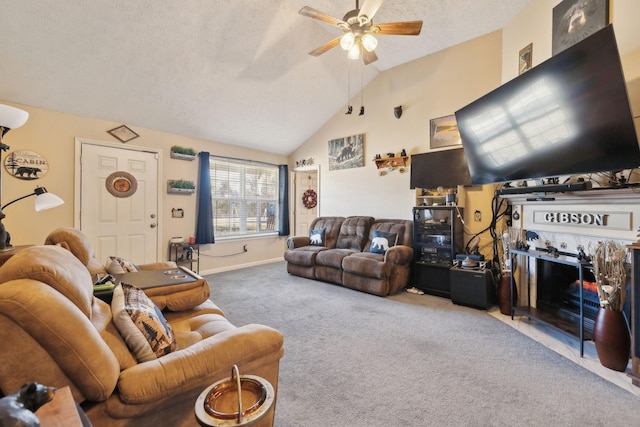 carpeted living room featuring vaulted ceiling, ceiling fan, and a textured ceiling