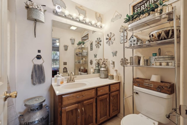 bathroom with toilet and vanity