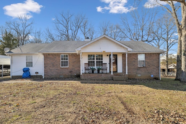 ranch-style home with covered porch and a front lawn