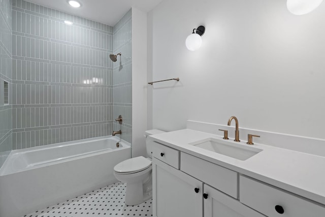 full bathroom with tiled shower / bath combo, vanity, and toilet