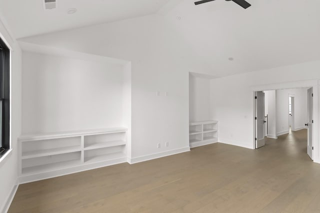 unfurnished room featuring ceiling fan, hardwood / wood-style floors, and vaulted ceiling