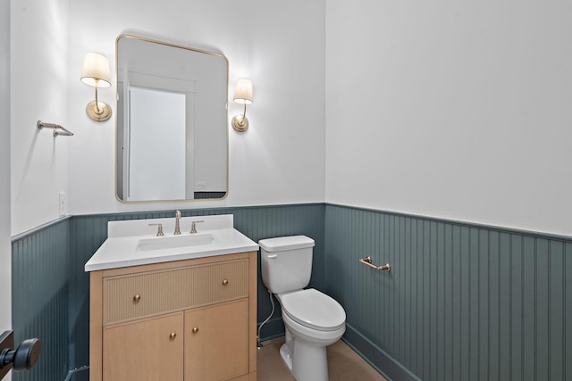 bathroom with toilet and vanity